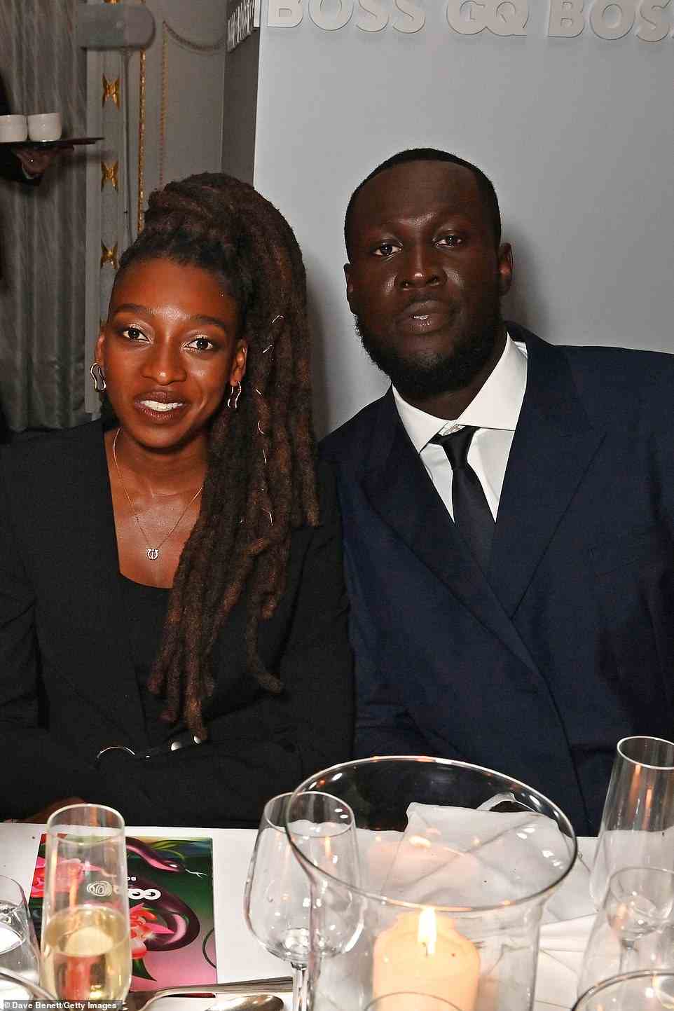 All smiles: Little Simz looked effortlessly glamorous as she posed with dapper Stormzy