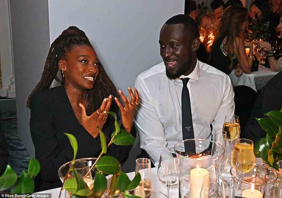 Good times: Stormzy was seen chatting with fellow singer Little Simz over dinner
