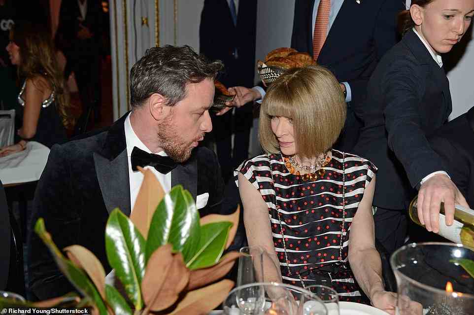 Chatting: James was seen socialising with Anna Wintour as they chatted during a meal at the awards ceremony