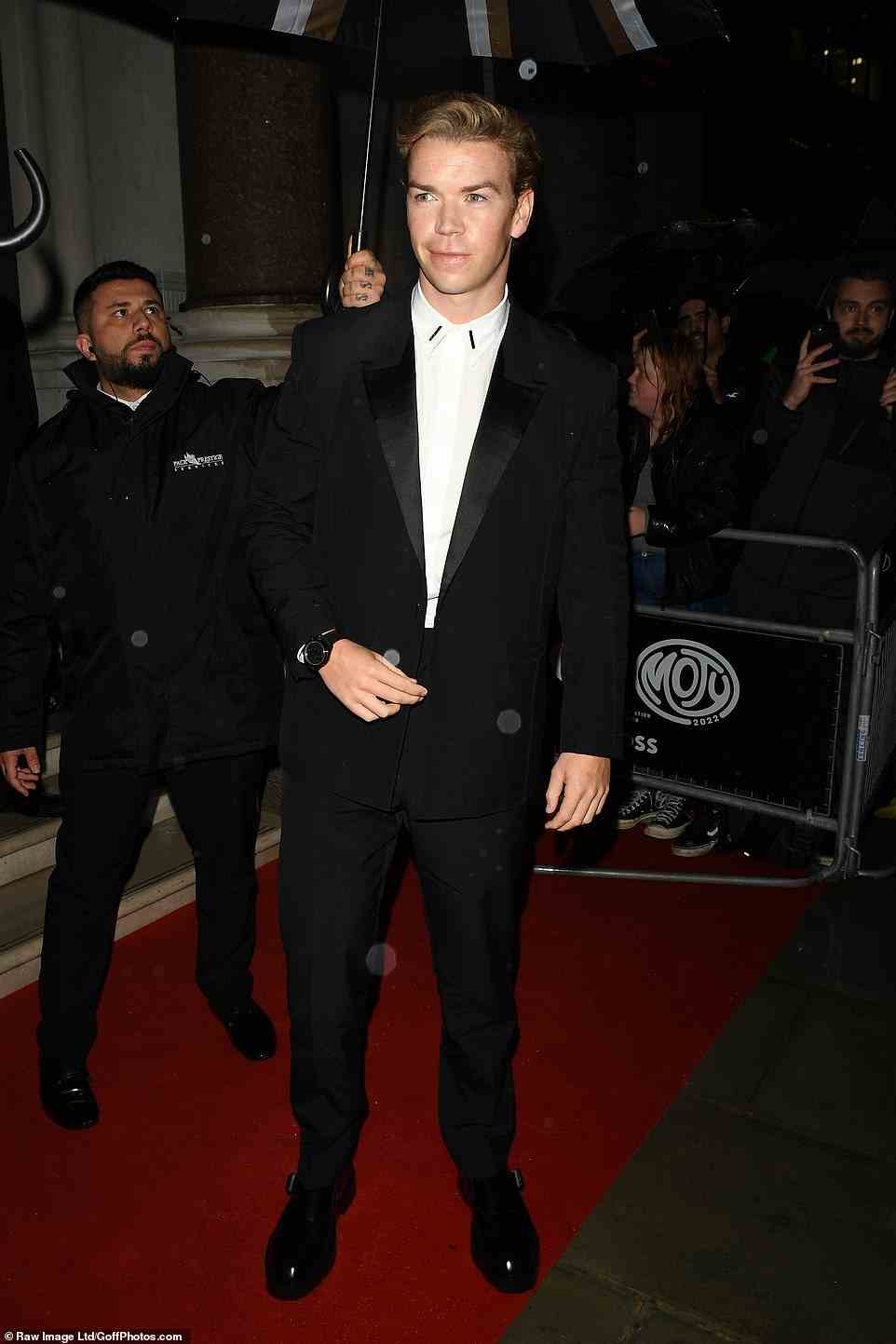 Poser: Will Poulter looked dapper in a black suit and white shirt, which featured small black collar embellishments