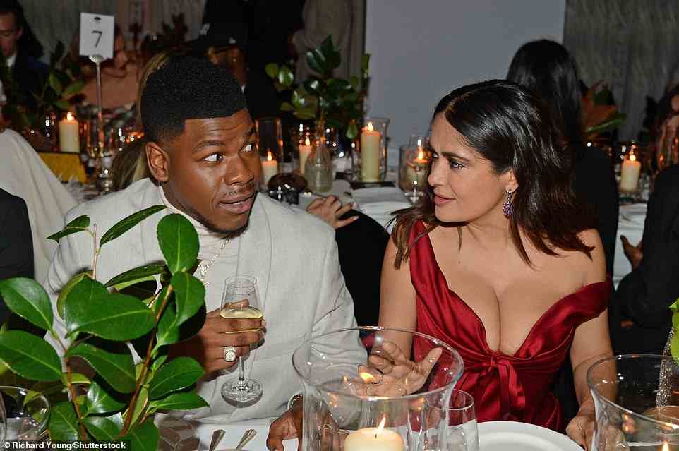 Candlelight: John Boyega and Salma Hayek were seen catching up over a drink at the stunning reception
