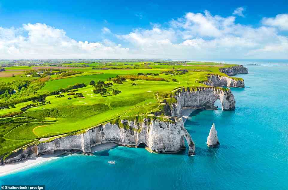 France's cliffs are also on the 'No' list - the coast of Etretat (above) in Normandy, France, faces 'frequent landslides from too much foot traffic' from travellers