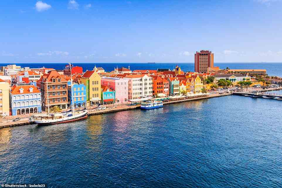 The Dutch Caribbean island of Curacao has a 'legendary underwater world of deep reefs'. Above is the country's capital, Willemstad