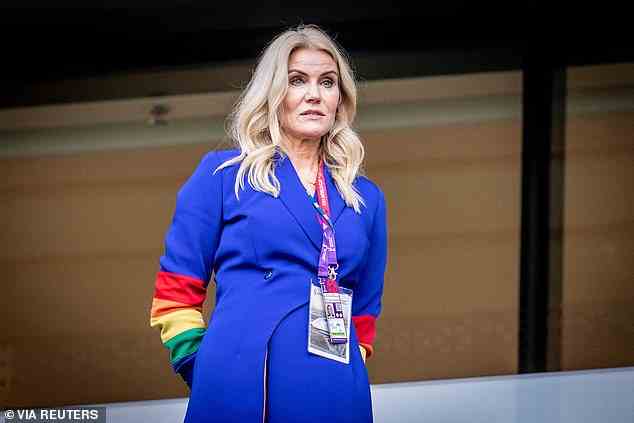 Former Danish Prime Minister Helle Thorning-Schmidt wears a rainbow-coloured outfit at yesterday's match against Tunisia in Qatar