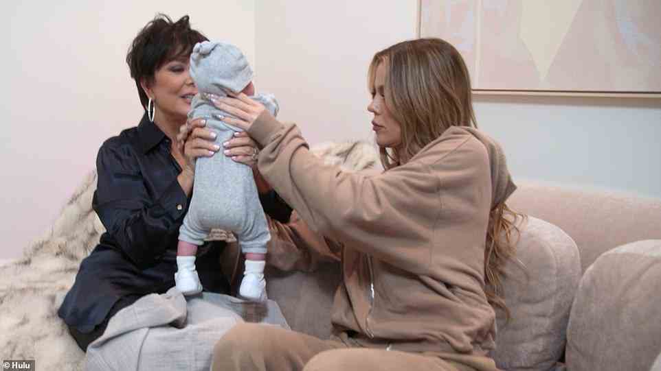 Holding: Back at home, Khloe is holding the baby under a blanket, never showing the baby's face, as Kris says how beautiful the baby is