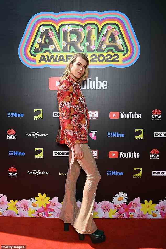 The reality star bared his torso in an open floral blazer and added even more sparkle to the look with a pair of sequinned pants