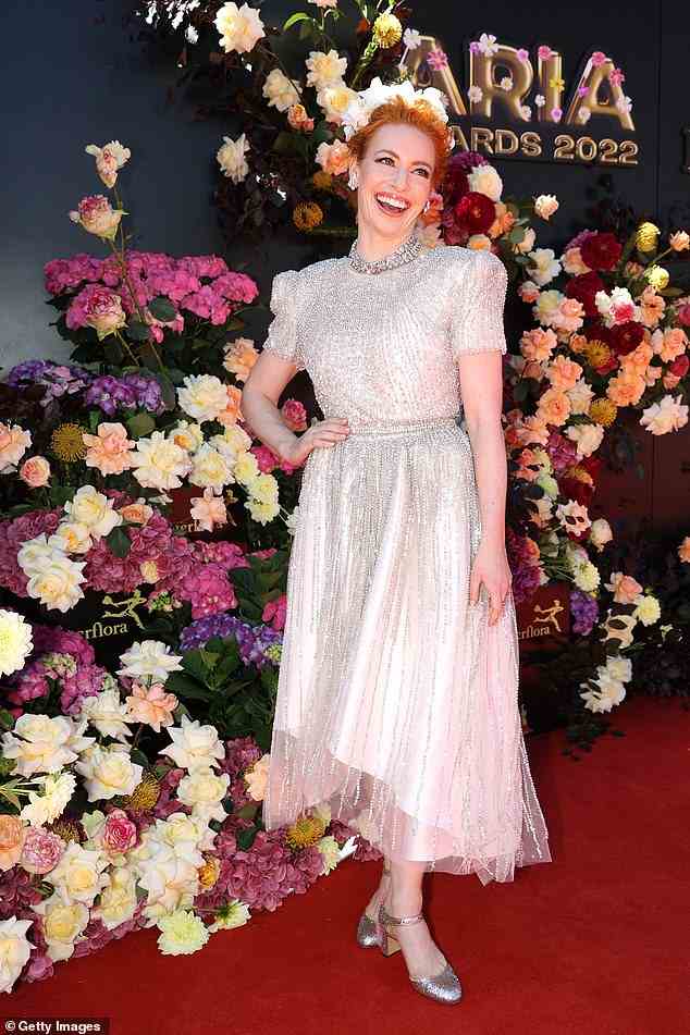 Also in attendance was former Wiggles member Emma Watkins. The kids entertainer looked a world away from her usual child-friendly and colourful attire in a sleek white and silver gown with chunky strapped heels and a flowery headband