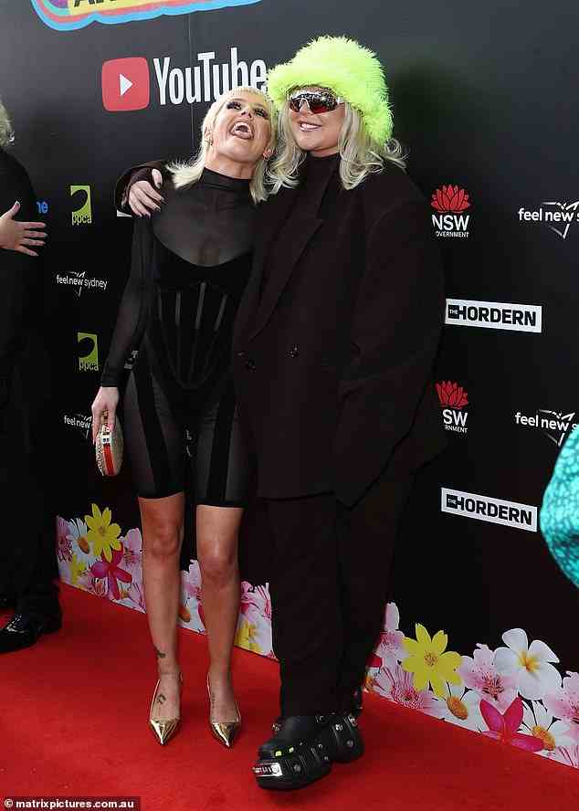 Aussie star Tones & I opted for her usually quirky style in all black with a statement green hat and $1550 Balenciaga Crocs
