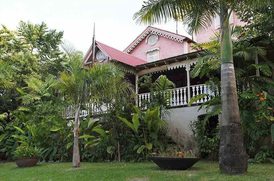 Pink Plantation House (pictured) is an 'impossibly beautiful' 150-year-old wooden house in an old cocoa plantation