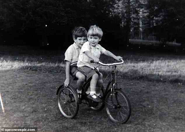 Robin & Rory Knight Bruce share a bike as children, with Rory on the front of the bike
