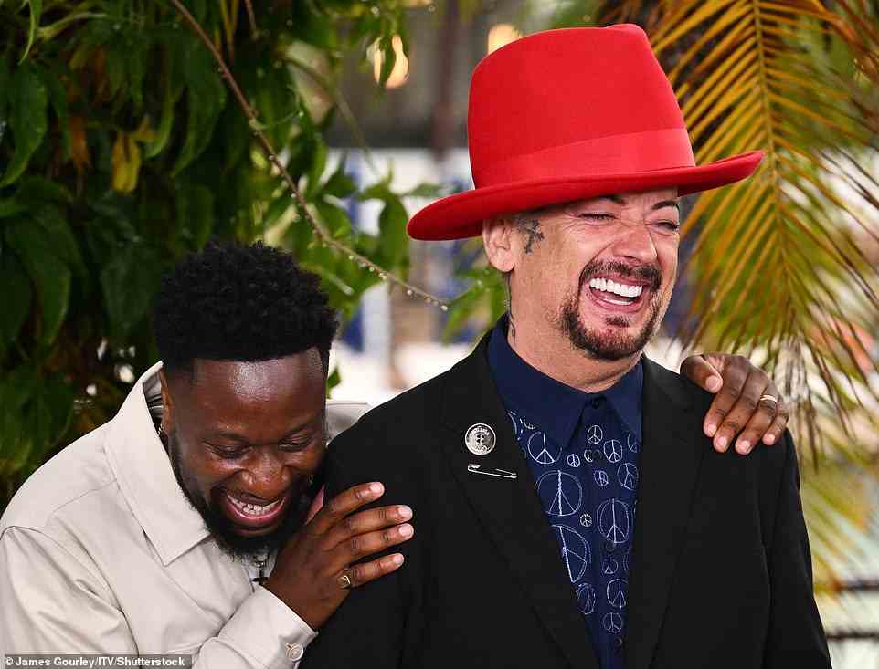 Fun times: Babatunde embraced Boy George as they shared a giggle at the bash