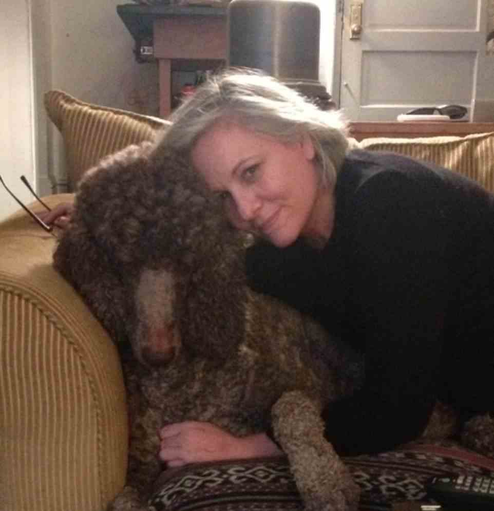 Ms Gangi at home with her dog in New York. She tried to keep things as normal as possible and continued working throughout her cancer treatment, but she said the fatigue from the vaccine therapy was 'profound'