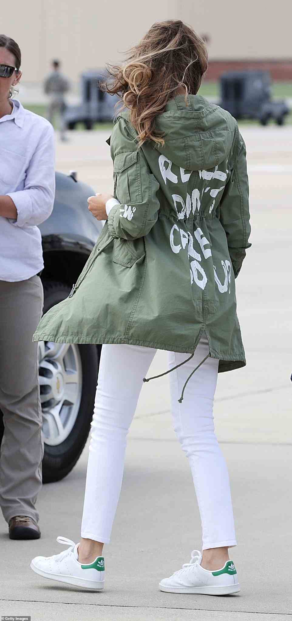 The piece of clothing was a reference to a similar coat that former First Lady Melania Trump wore when she went to visit immigrant children, which said, 'I really don't care. Do you?' (seen above)