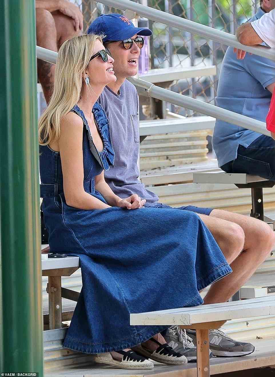 The couple had bright smiles on their faces as they sat in the stands during the game
