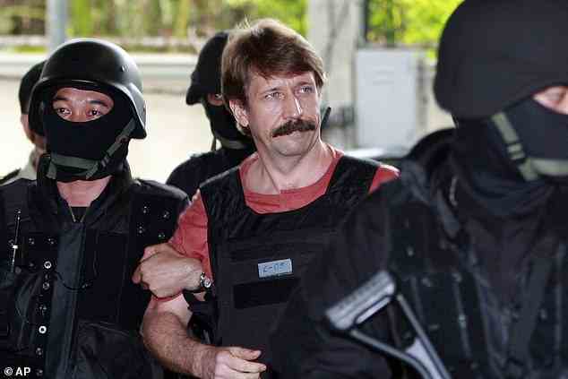 Suspected Russian arms smuggler Viktor Bout, center, is led by armed Thai police commandos as he arrives at the criminal court in Bangkok, Thailand in Oct. 5, 2010. Russia has freed WNBA star Brittney Griner on Thursday in a dramatic high-level prisoner exchange, with the U.S. releasing notorious Russian arms dealer Viktor Bout