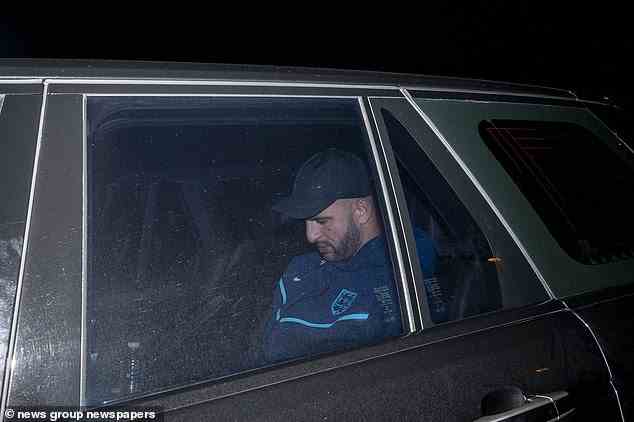 Manchester City defender Kyle Walker looks down as he is driven away from the airport this evening