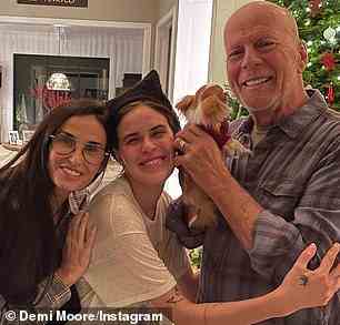 'We are FAMILY! Getting into the holiday spirit,' she captioned an array of photos that featured them all enjoying a meal together, posing as a group, and playing with some puppies