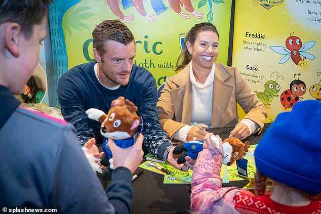 Book: The WAG, 40, and the footballer, 35, beamed while chatting to kids and parents at the event to launch Cedric The Little Sloth with a Big Dream