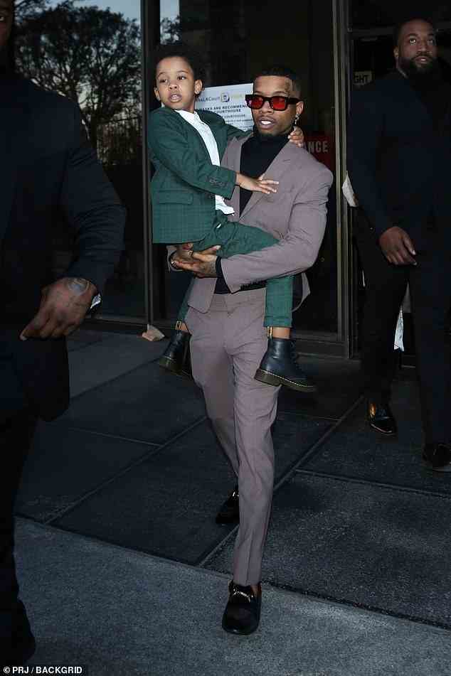 Lanez was pictured leaving court while holding his child - for the second day in a row