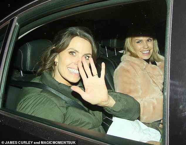 Beaming: Ellie Taylor wrapped up in a khaki coat and waved to onlookers