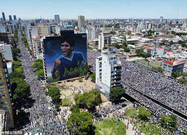 A mural of Diego Maradona, who Messi emulated by winning the World Cup, is seen in the city