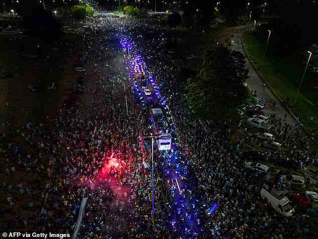 Fans lined the streets near to the airport to welcome home Argentina's World Cup winners