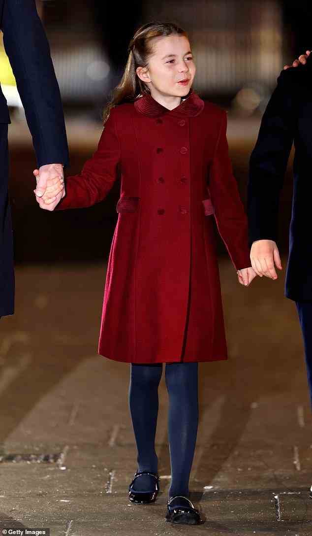 Princess Charlotte also wore a matching deep burgundy-coloured coat at the carol service