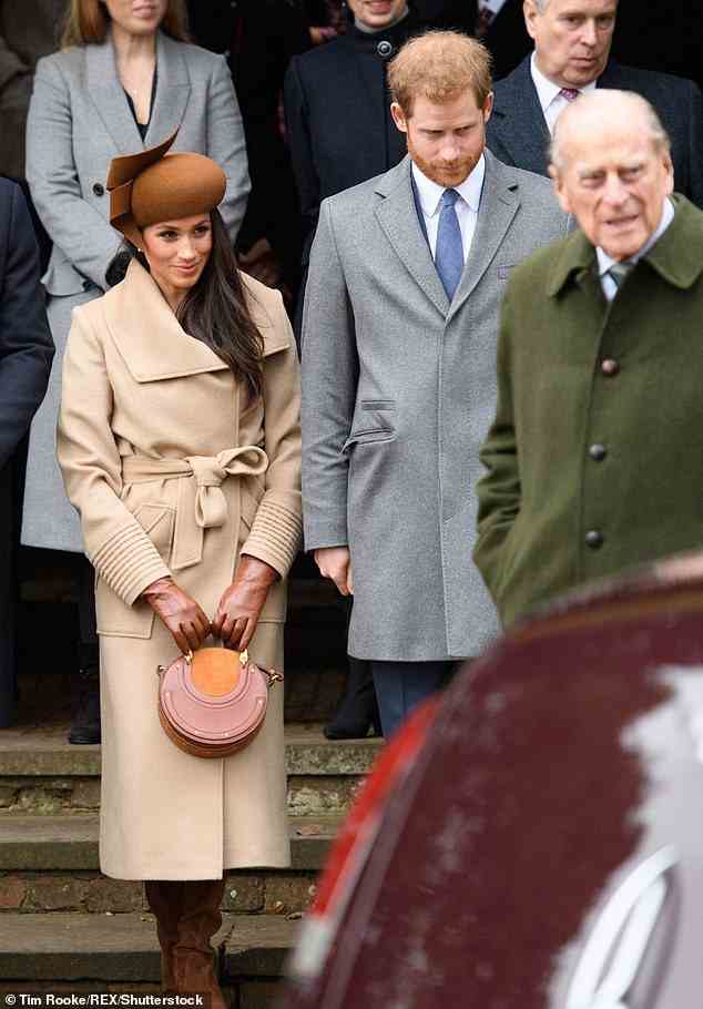 In her Netflix interview, Meghan said: ¿So I was like, ¿Well, what¿s a colour that they¿ll probably never wear?¿ Camel? Beige? White? So I wore a lot of muted tones, but it also was so I could just blend in' (Pictured: The Duke and Duchess of Sussex at Sandringham in 2017, alongside the late Duke of Edinburgh)