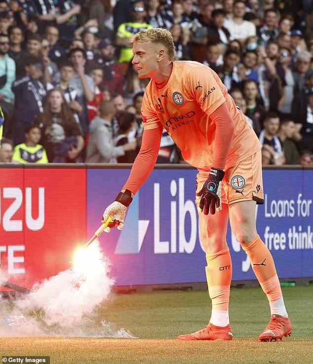 Melbourne City goalkeeper Tom Glover had a flare thrown near him during Saturday's derby, and then threw it back in the stands