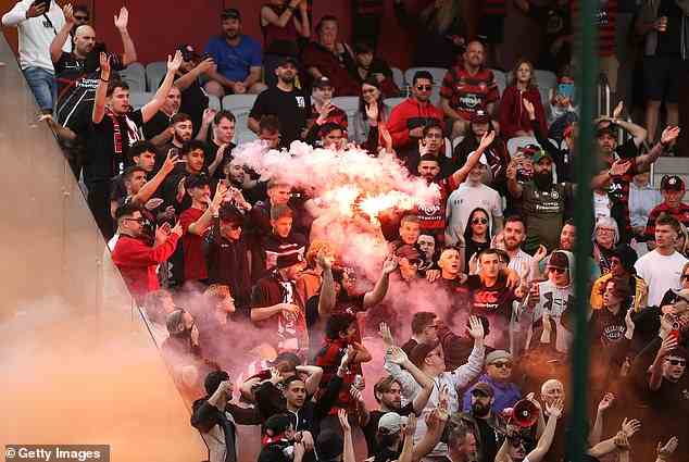 Western Sydney Wanderers fans light and throw flares in the club's recent clash with Wellington at WIN Stadium