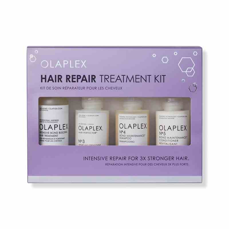 Olaplex Hair Repair Treatment Kit lila Schachtel mit weißen Flaschen auf weißem Hintergrund