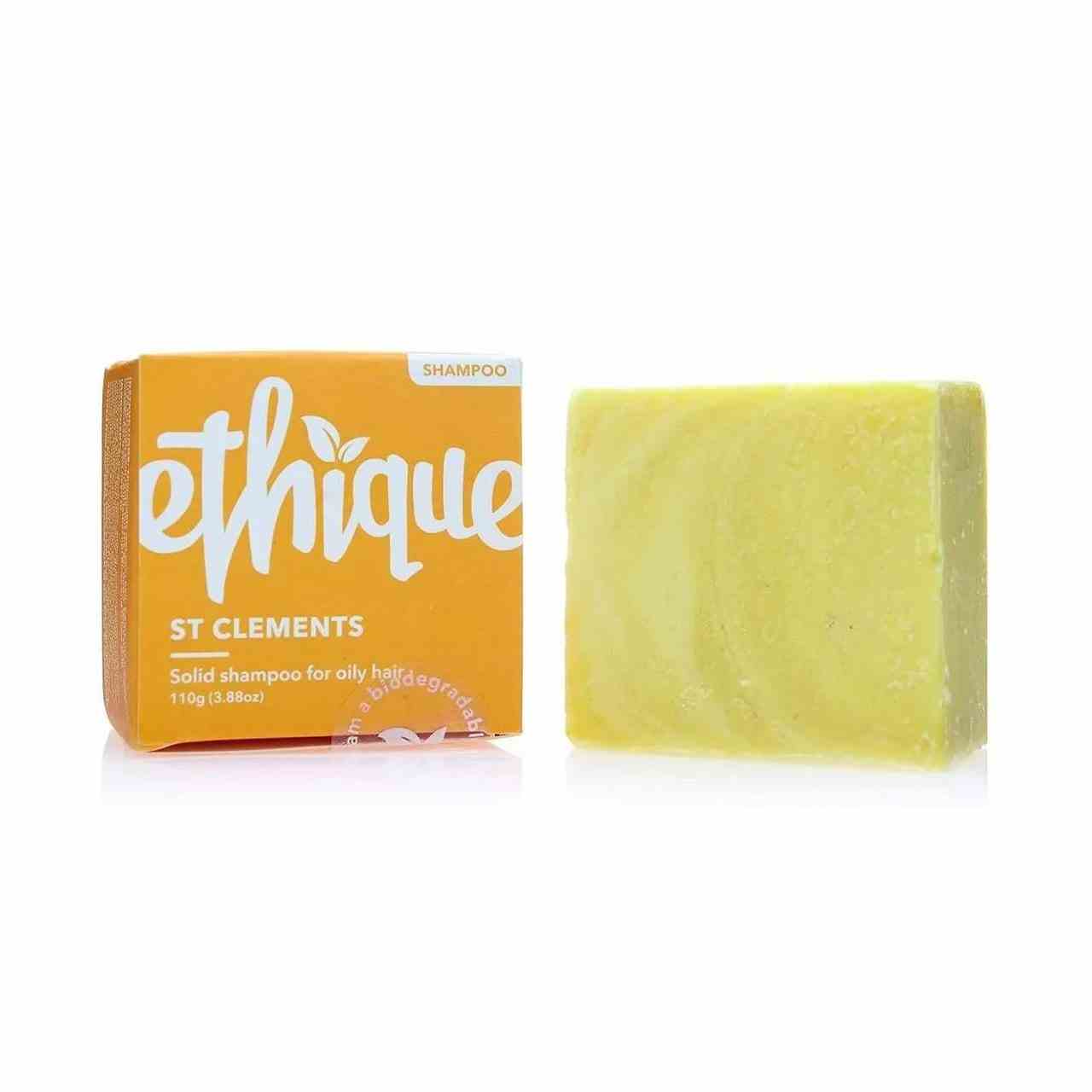 Ethique Shampoo Bar für fettiges Haar gelber Shampoo Bar mit orangefarbener Box auf weißem Hintergrund