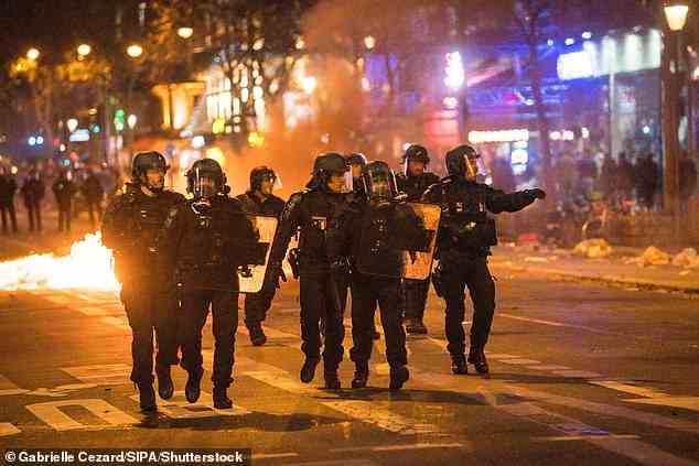 Five police were among the injured in Paris after demonstrators set fire to the streets in response to the tragic deaths of three Kurds, who were massacred by a 'racist' gunman in the heart of the city