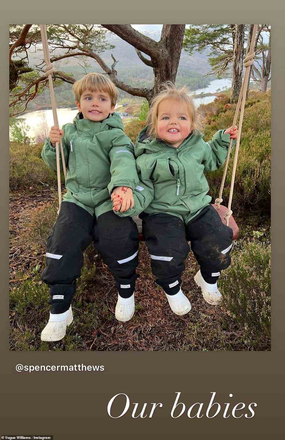 'Our babies' The couple's adorable children held hands while swinging together as they got some fresh air on Christmas morning