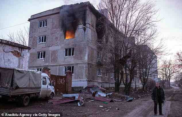 Pictured: A building burns in the south part of shelled area in Bakhmut, Ukraine on December 21
