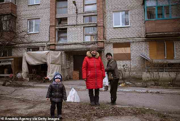 Pictured: Local people who received food supply in an humanitarian aid distribution as daily life continues in Bakhmut, Ukraine on December 21, 2022