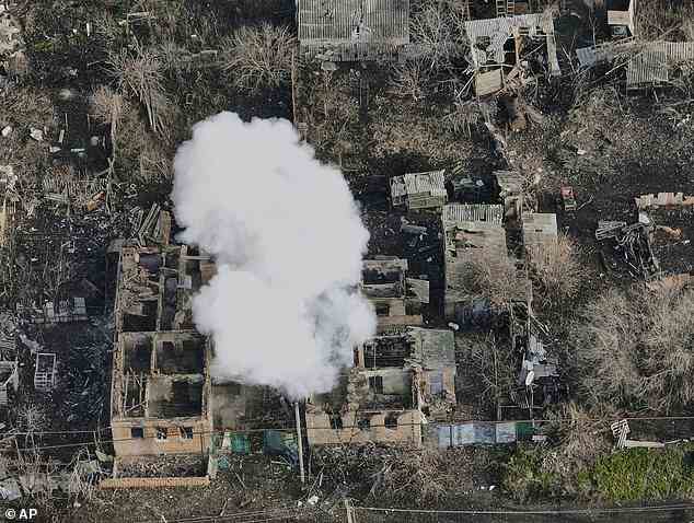 Pictured: Smoke billows after Russian attacks in the outskirts of Bakhmut, Ukraine, on December 27, 2022