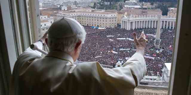 Pope Benedict XVI delivers his blessing during his last Angelus Prayer from the window of his studio overlooking St. Peter's Square at the Vatican, Feb. 24, 2013.
