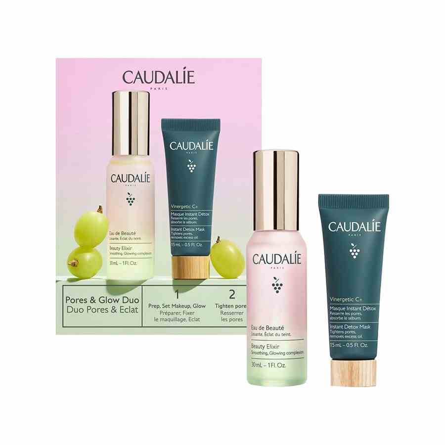 Caudalie Pores und Glow Duo zwei Mini-Hautpflegeprodukte mit rosa Box auf weißem Hintergrund