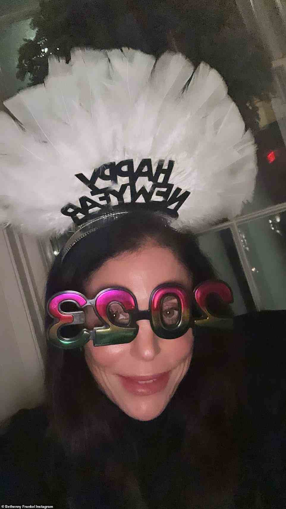 Dressing up: Bethenny Frankel shared a selfie of herself wearing a black and white feathery headband that also contained Happy New Year