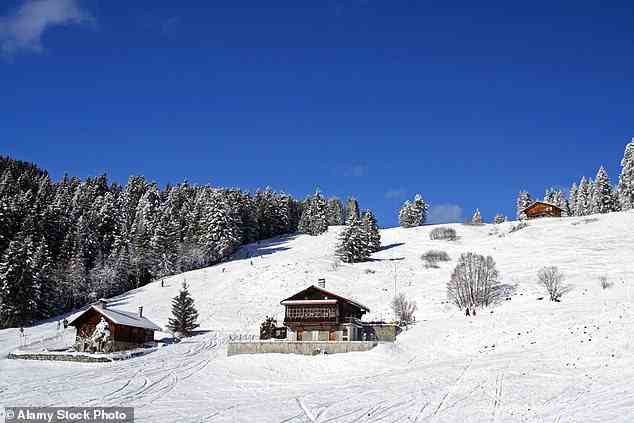 VILLARS-SUR-OLLON, SWITZERLAND: The same Swiss resort is seen during the snowy season