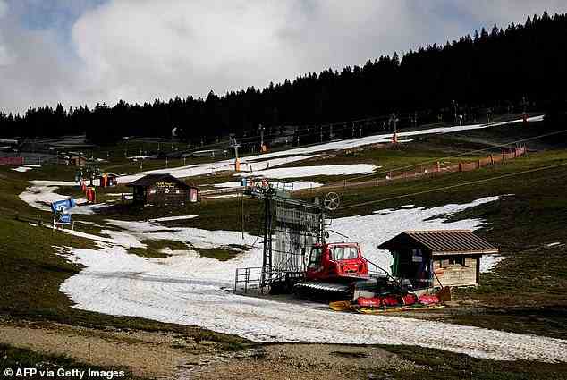 LE SEMNOZ, FRANCE: Surrounded by melted snow, the Le Semnoz ski resort, near Annecy, stands empty last week as the winter heat wave hits Europe