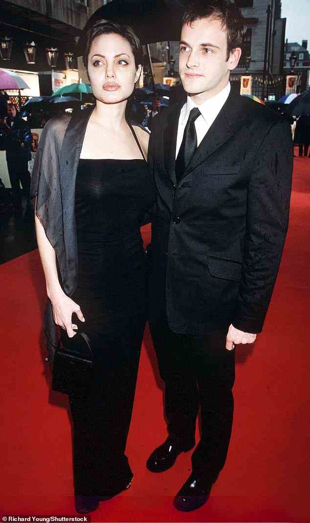 Angelina (seen with Jonny in 1998) wore black, rubber pants and a white shirt that had Jonny's name written in her own blood on the back - as a 'testament to her offbeat approach to life'