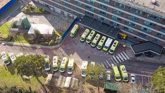 Ambulances wait outside Portsmouth Hospital due to shortages of rooms as patients wait inside the vehicles for hours