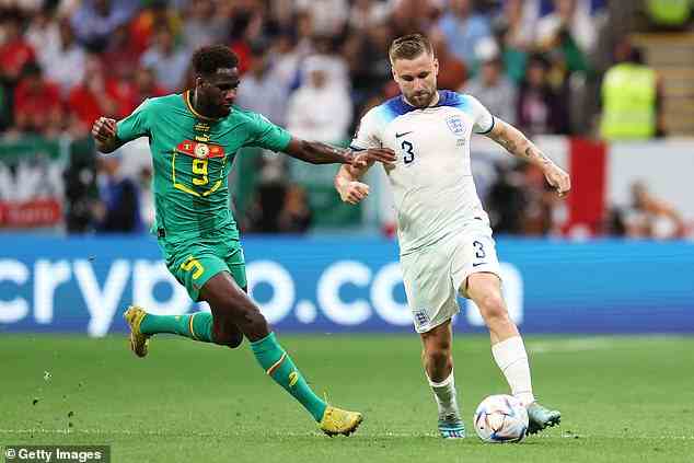 Boulaye Dia chases Luke Shaw during Senegal's meeting with England at the World Cup