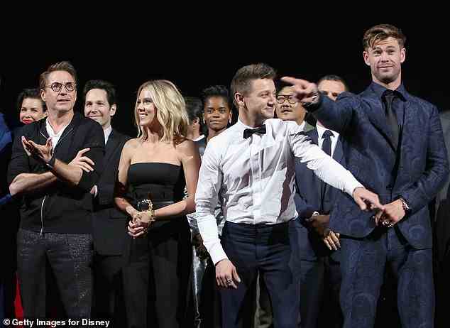 Renner pictured with his Marvel cast members, including Robert Downey Jr. (front left), Johannson (front second left) and Chris Hemsworth (front right) in 2019