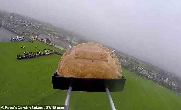 The pasty (pictured) was attached to a weather balloon and was suspended for 93 minutes before freezing temperatures popped the balloon and it fell back to earth on Bodmin Moor in Cornwall