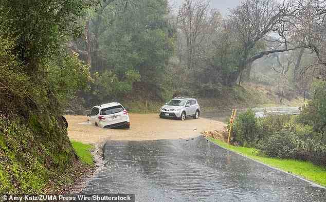 Pictured: The Suburu Forester is seen sunken into the mud near Santa Barbara