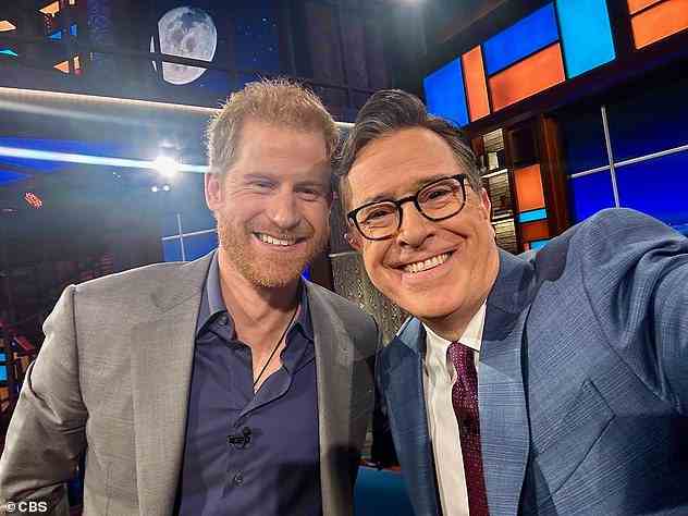 The Late Show host Stephen Colbert (right) takes a selfie with Prince Harry (left)