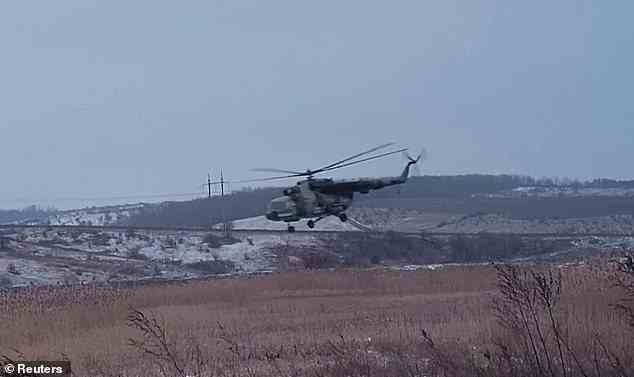 Pictured: A Ukrainian helicopter is seen flying over a field near Soledar. Despite Moscow focusing vast resources on capturing the small city, analysts have said it offers little tactical benefit to the invaders and their plan to push on to the nearby city of Bakhmut